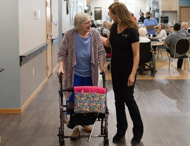 Senior woman with walker caring nurse Senior woman with walker caring nurse